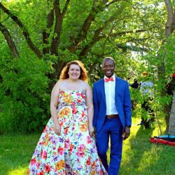Gorgeous inspiration for your casual backyard wedding reception. Check out the bride's sweet wedding dress with a bright floral pattern. Don't they look stunning? I love the groom's navy suit with coral accents.