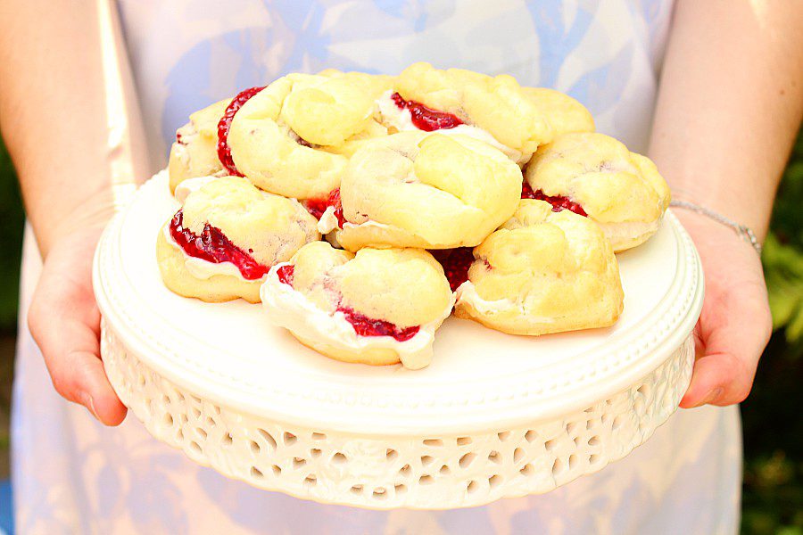 Everyone loves a classic easy cream puff recipe, but sometimes the same-old can get a little boring.  Here's a great cream puff filling idea: coffee flavoured whipped cream with raspberry sauce. . . yum! A simple homemade dessert that will take your basic choux pastry up a notch. #creampuffs #raspberrysauce #coffeerecipes #coldbrewcoffeerecipes #creampuffrecipe #easydessert #sweettreats