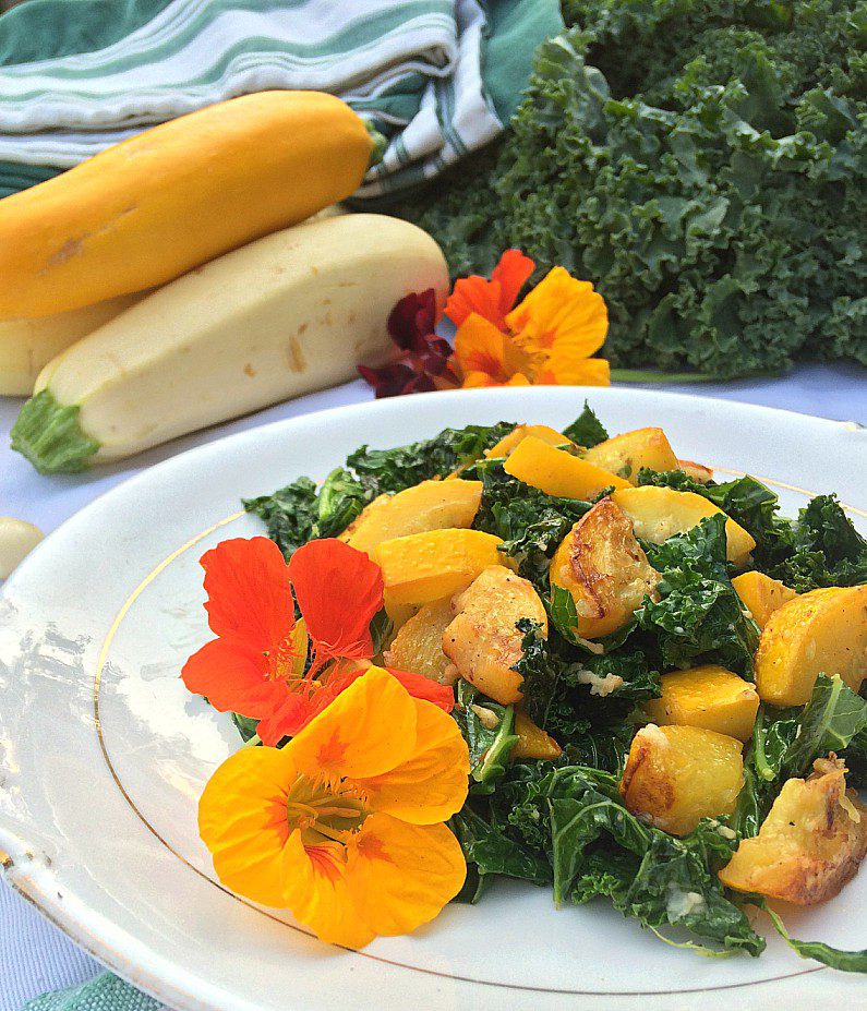 An easy summer side dish recipe to use up your garden produce. Tender zucchini and crisp kale shine when fried and paired with garlic and parmesan. So good even your zucchini-hating friends will like it. Sub in summer squash for a tasty alternative!
