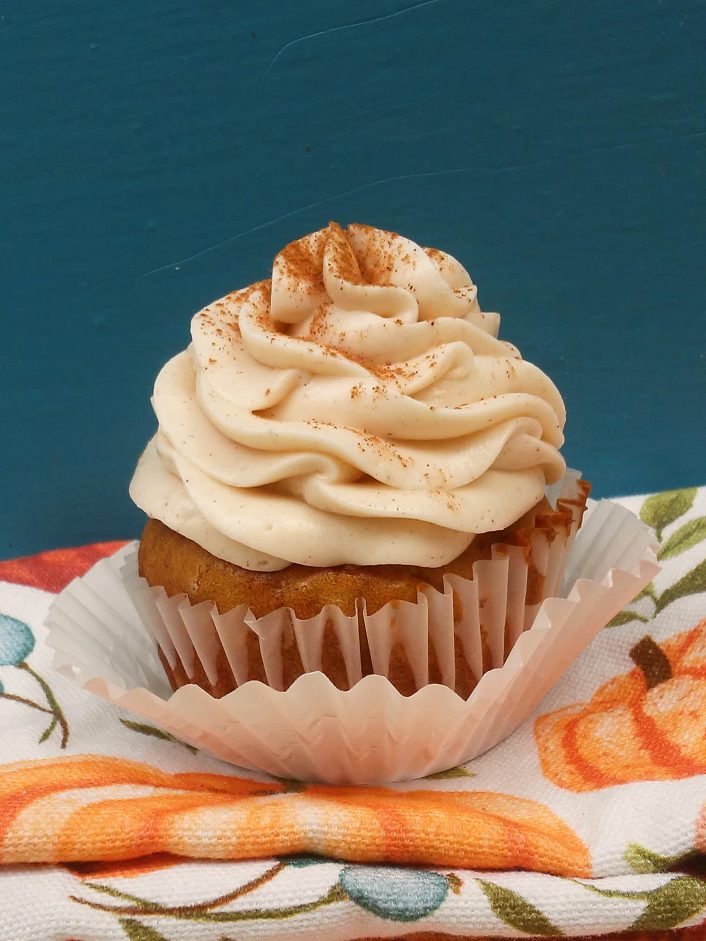 Aaaah!  These Pumpkin Spice Cupcakes with Cinnamon Cream Cheese Frosting are every basic girl's dream fall dessert recipe!  It's the best, easy, from scratch recipe for Halloween or thanksgiving.  I dare you not to lick the icing of these muffins!! #pumpkin #pumpkinspice #icing #frosting #creamcheese #cupcakes #muffins #easy #best #recipe #dessert #Thanksgiving #Halloween