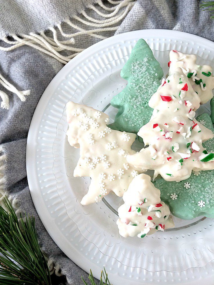 Give your holiday baking a little extra cheer with these white chocolate covered Rice Krispie Christmas Trees. Simple and easy to make as gifts or to add to your Christmas baking tray. But be warned, everyone will be asking for the recipe! #christmas #holiday #baking #ricekrispie #ricekrispietreat #christmasbaking #holidaybaking #easy #recipe #dessert #kids #gift #diygift #whitechocolate