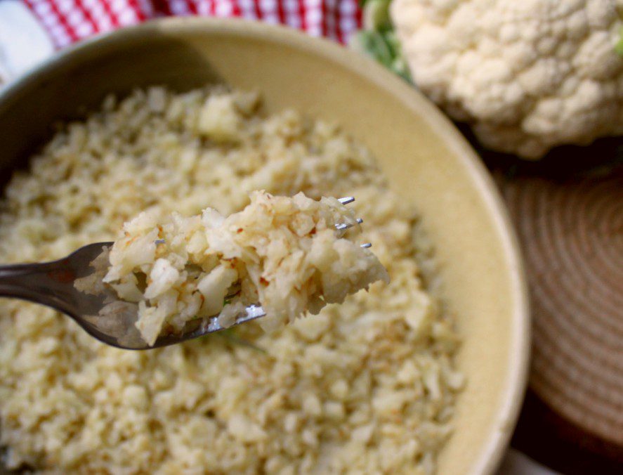 Ever wondered how to make cauliflower rice? Here's an easy healthy recipe to replace rice or pasta. It's low carb, vegetarian, paleo, whole 30, or keto friendly. So simple and delicious! I know I'll be planting more cauliflower in my vegetable garden this year just so I can make more of this! #cauliflowerrecipe #cauliflowerrice #lowcarb #keto #one3one #vegetarian #paleo #glutenfree #healthyrecipe #healthy #lunch #dinner #supper
