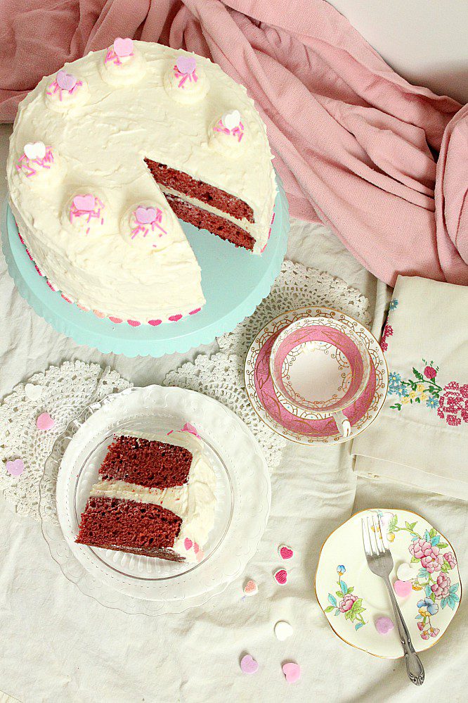 Looking for a the Goldilocks of Red Velvet cakes with cream cheese frosting?  This one is made with beets, very little food colouring, and without buttermilk.  It's an easy, from scratch recipe that's perfect for your Valentines day baking. #redvelvetcake #creamcheesefrosting #beets #fancycake #Valentinesday #baking #valentinesbaking #bakingwithbeets #bakingwithvegetables