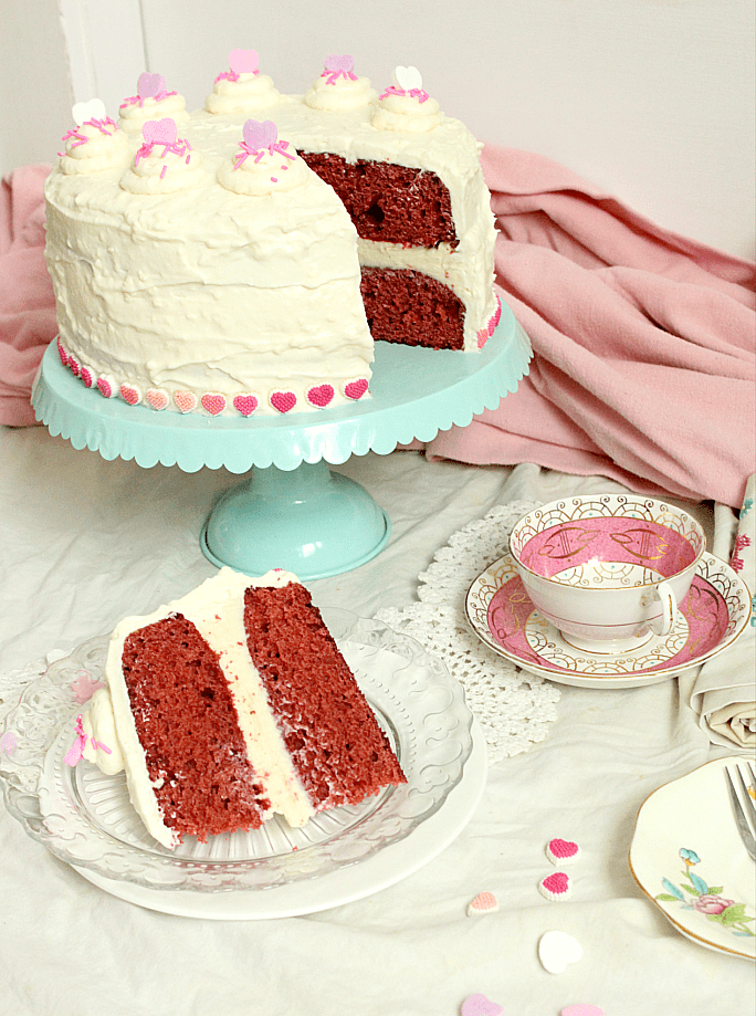Looking for a the Goldilocks of Red Velvet cakes with cream cheese frosting?  This one is made with beets, very little food colouring, and without buttermilk.  It's an easy, from scratch recipe that's perfect for your Valentines day baking. #redvelvetcake #creamcheesefrosting #beets #fancycake #Valentinesday #baking #valentinesbaking #bakingwithbeets #bakingwithvegetables