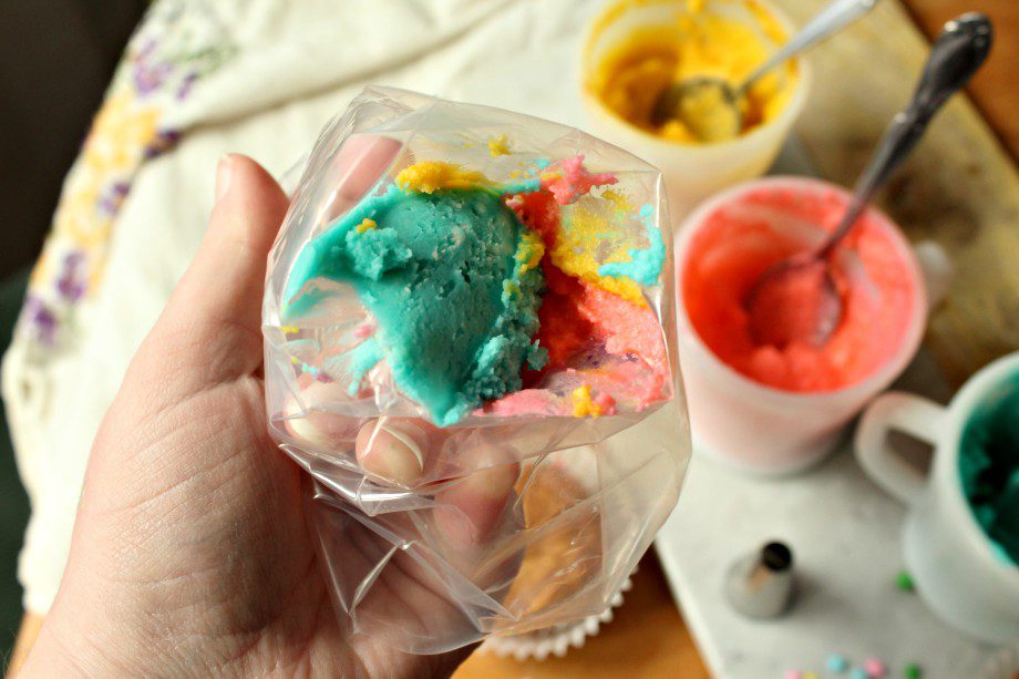 Calling all Leprechauns! You'll love these easy to make St. Patrick's Day rainbow cupcakes. With just a little foodcoloring and creative icing techniques, you can make this dessert for kids, a potluck, or as a special party treat. #stpatricksday #rainbowcupcakes #rainbowicing #easydessert #sweettreats #baking #forkids