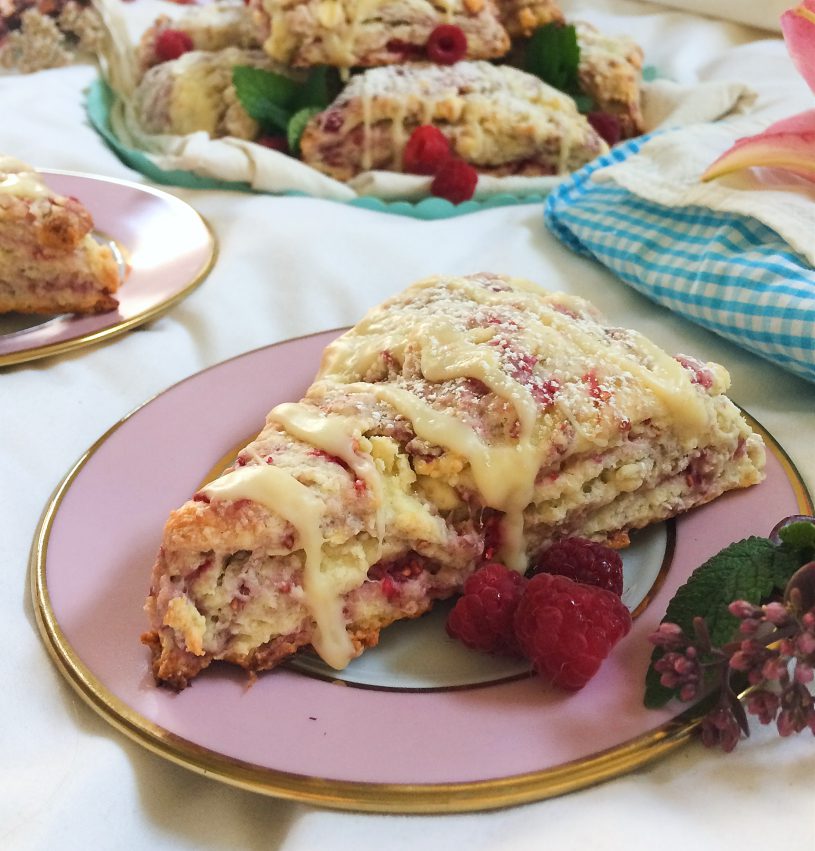 Seriously, you need these raspberry white chocolate scones in your life.  They're an easy and simple summer dessert recipe that is perfect for breakfast, dessert, or as a snack. #raspberry #whitechocolate #scone #sconerecipe #dessert #baking 