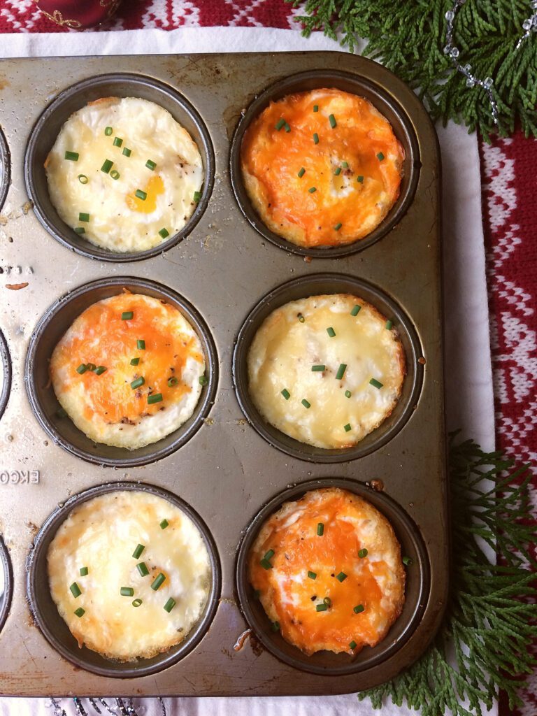 This Christmas morning breakfast idea is so easy and fast that there's no need to make ahead or overnight.  Baked eggs in muffin tins are great for a savoury brunch for a crowd, families, and kids.  Bonus, there's only 10 minutes of prep so you'll be out of the kitchen fast! #christmasmorning #christmasbreakfast #glutenfree