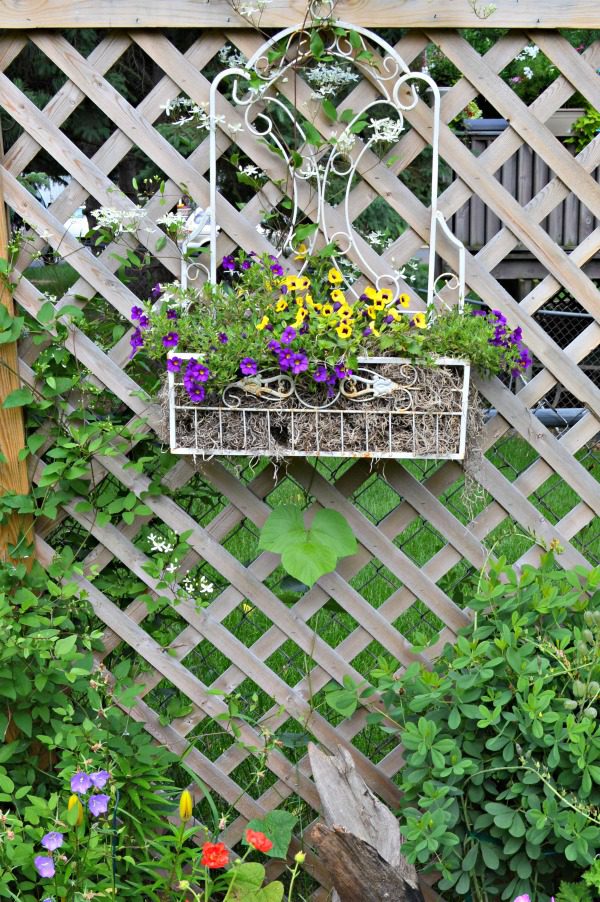 I think whimsical garden art really makes a backyard flower bed.  I love these 20 diy ideas that are either recylcled, upcylcled, or from junk that nobody wants.  I need to do some of these in my outdoor space. #gardenart #whimsical #flowergarden #landscapingideas