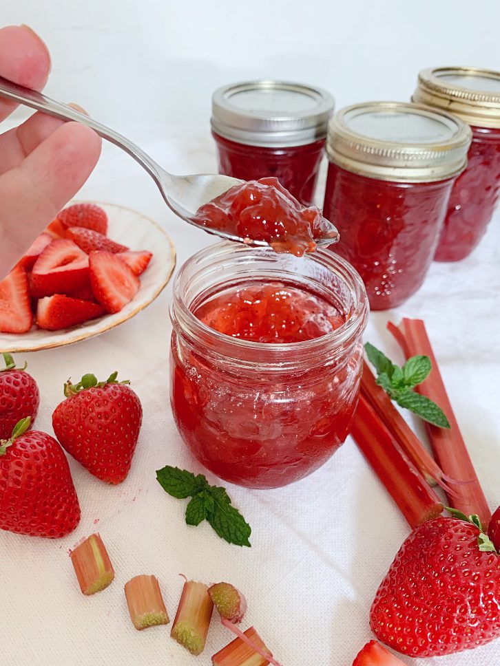 Delicious strawberry rhubarb jam made with pectin using water bath canning.