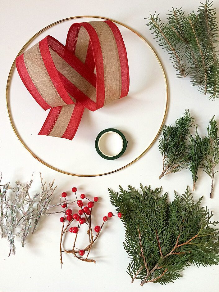Want money saving Christmas decorations at dollar store prices? This DIY Christmas wreath is sure to suit your wallet and your home decor. You'll love the rustic and minimal style. #christmasdecor #christmaswreath #holiday #rusticchristmas #rustic #minimalism #minimalchristmas #ppholiday